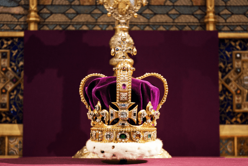 The St Edward's Crown is the centrepiece of the coronation regalia. This magnificent crown is made of gold and decorated with 444 precious stones, including sapphires, rubies, and diamonds.